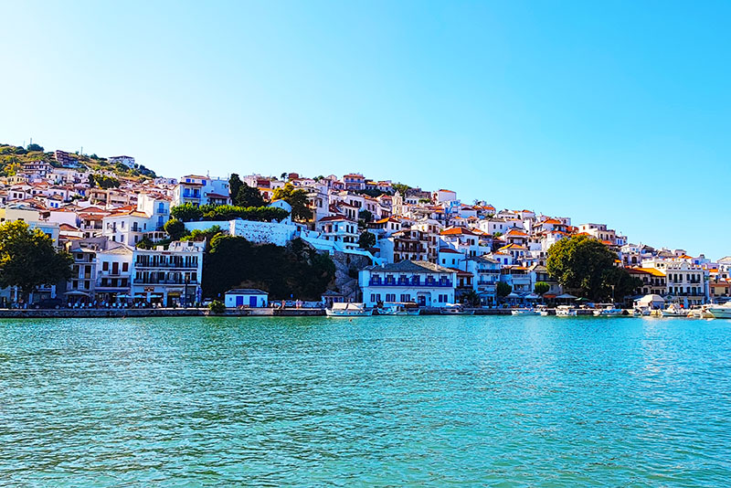 Skopelos Town with white houses on a hillside