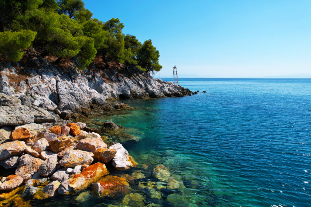 Turquoise sea and pine trees on Skopelos island, Sporades